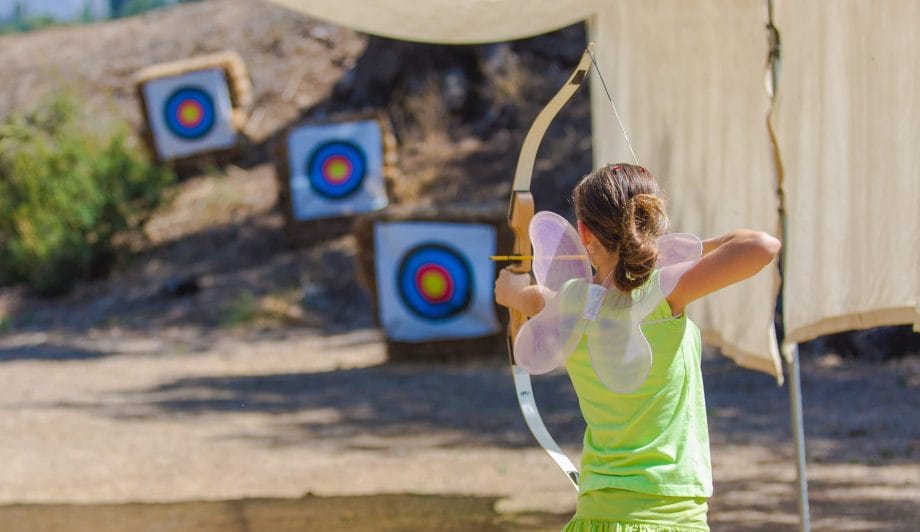 Girl in Fairy Costume doing Archery