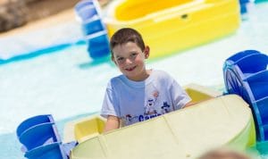 Boy riding paddleboat