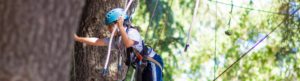 Camper doing ropes