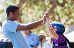 Camper getting high five