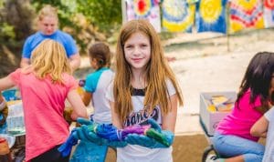 Girl making tie-dye shirt