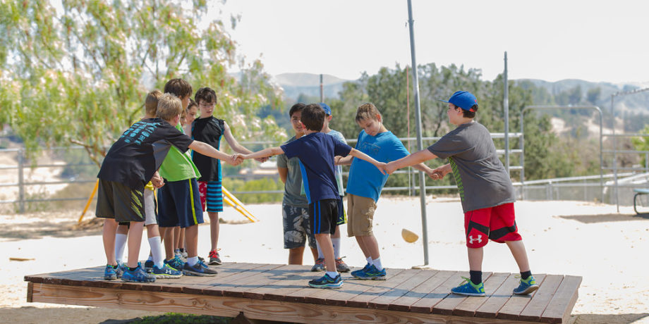 Campers balancing on balance board