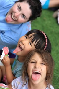 Campers and Counselor Sticking their tongues out