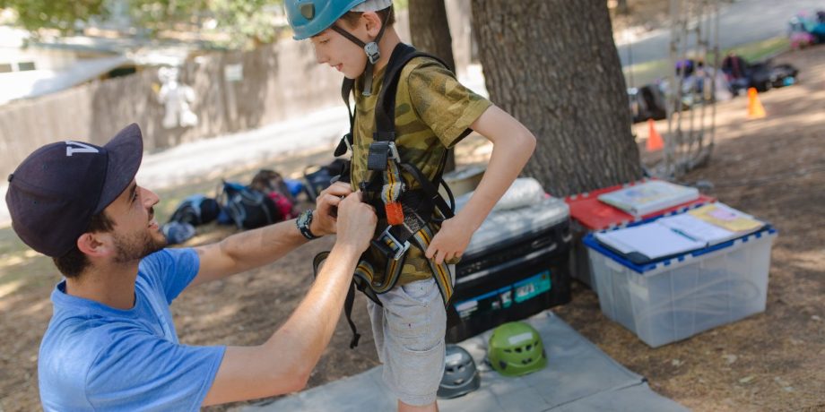 Camper getting ready for high ropes