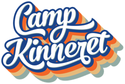 Camp Kinneret" is written in bold, white script with a blue outline, casting a retro shadow in orange, yellow, and brown shades.